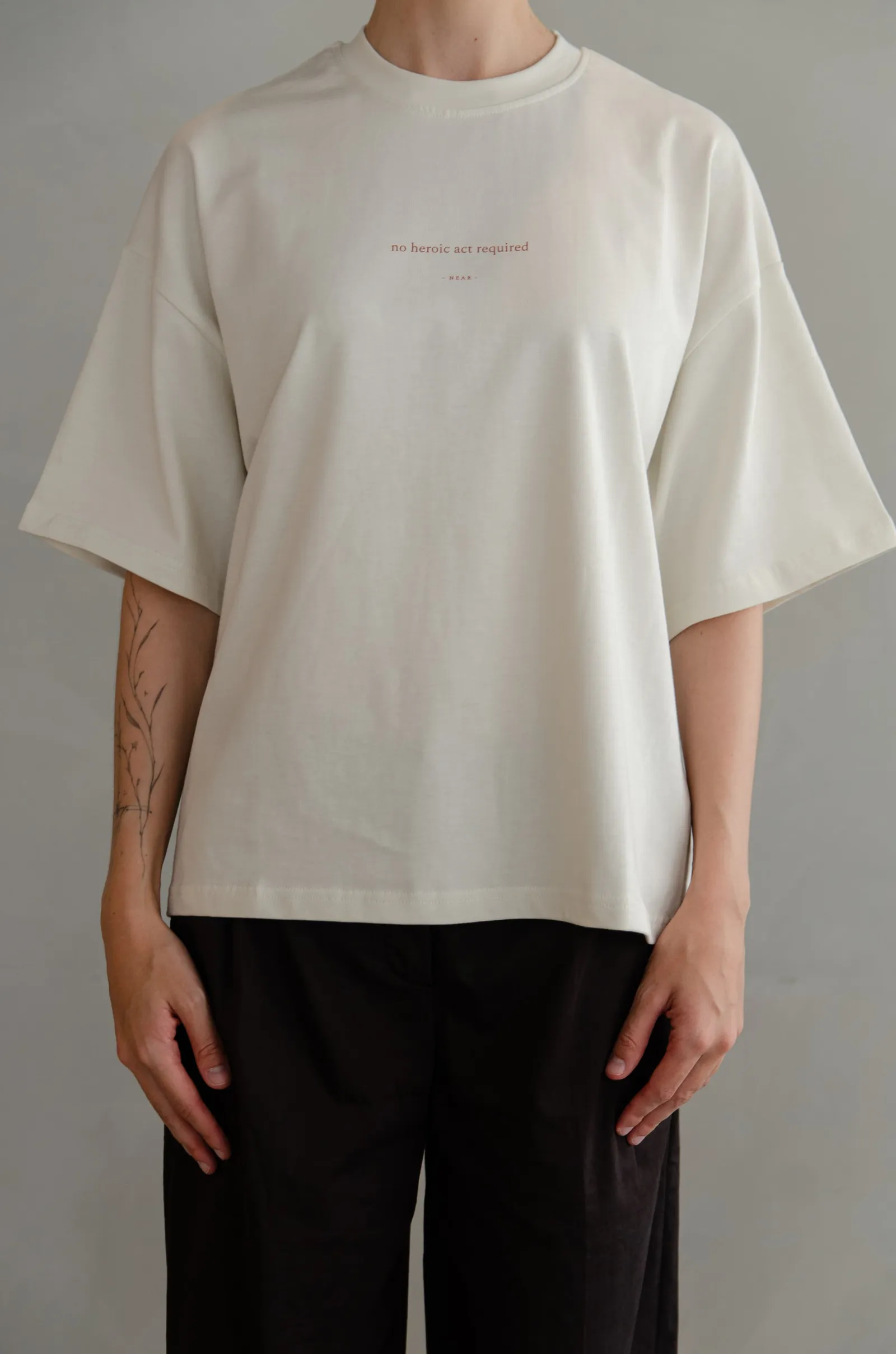 NEAR heavyweight vintage-white tee printed “no heroic act required” — photo 8 of 11.