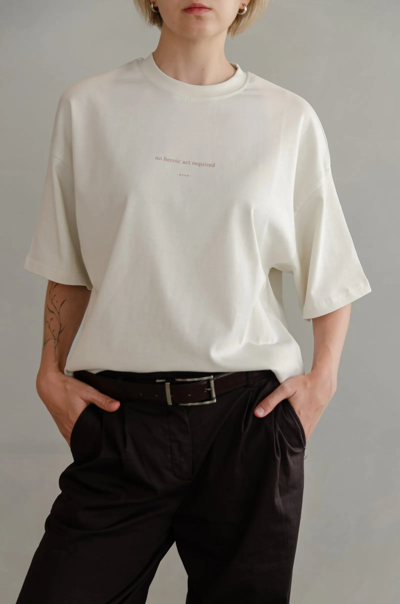 NEAR heavyweight vintage-white tee printed “no heroic act required” — photo 10 of 11.
