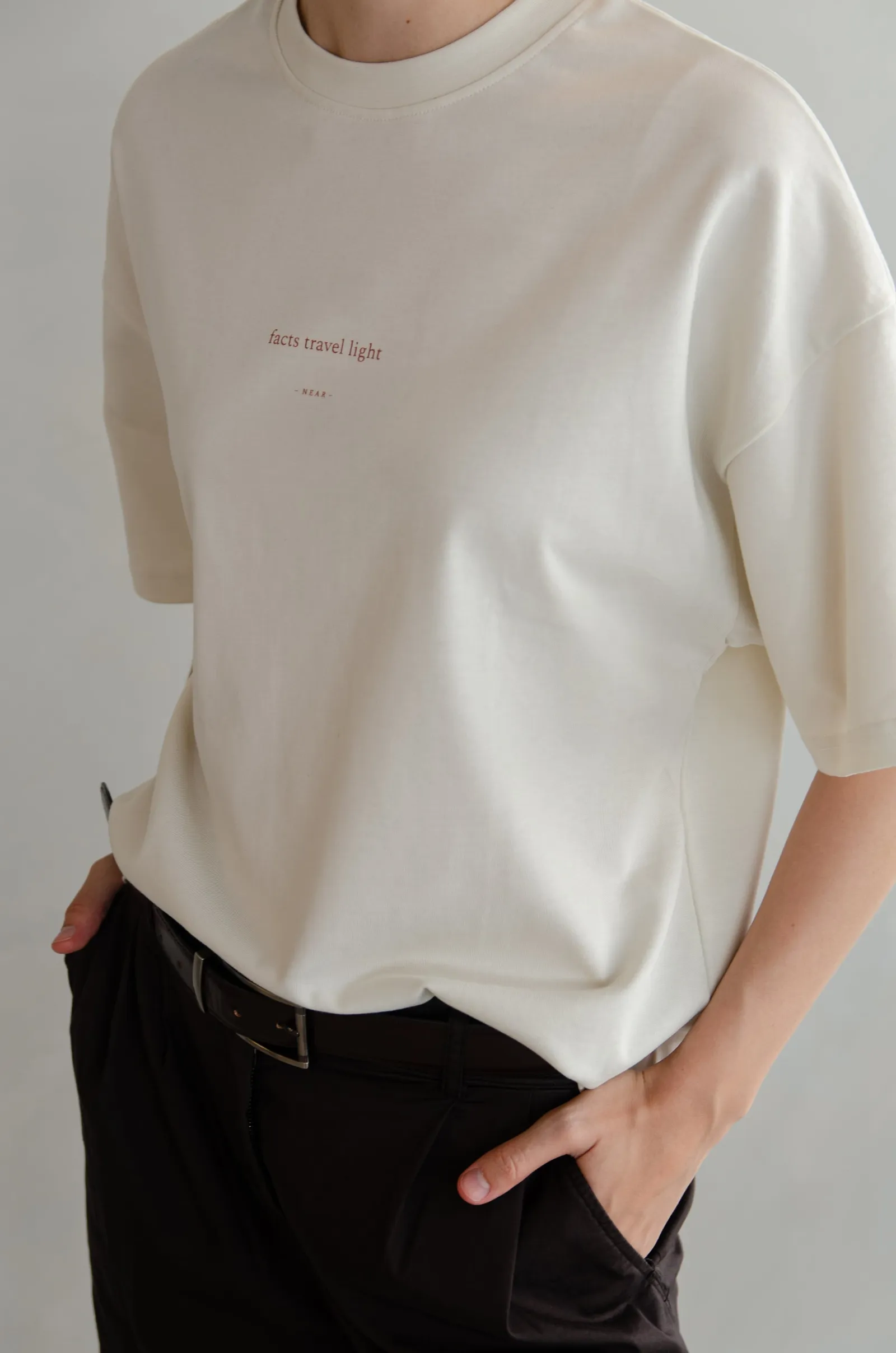 NEAR heavyweight vintage-white tee printed “facts travel light” — photo 11 of 11.